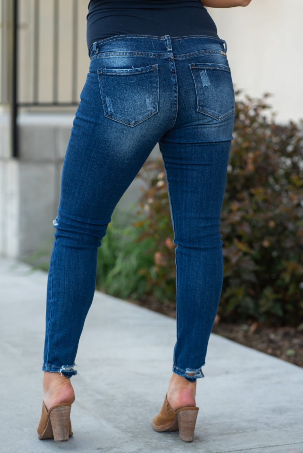 KanCan Maternity Jeans Do you miss wearing jeans? These maternity jeans will keep you comfy and cute with an elastic stretch waistband that fits just under the tummy. Color: Dark Wash Distressed Legs and Ankle Cut: Skinny, 27" Inseam Rise: Mid-Rise with Full Tummy Band, 5.5" Material: 94% COTTON, 4% T-400, 2% SPANDEX Style #: KC3018M Contact us for any sizing questions or measurements.