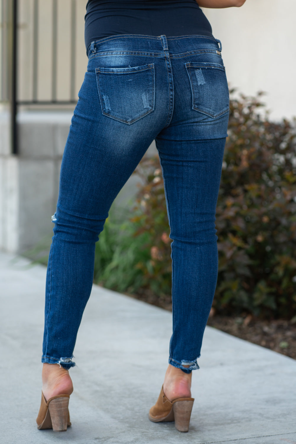 KanCan Maternity Jeans Do you miss wearing jeans? These maternity jeans will keep you comfy and cute with an elastic stretch waistband that fits just under the tummy. Color: Dark Wash Distressed Legs and Ankle Cut: Skinny, 27" Inseam Rise: Mid-Rise with Full Tummy Band, 5.5" Material: 94% COTTON, 4% T-400, 2% SPANDEX Style #: KC3018M Contact us for any sizing questions or measurements.