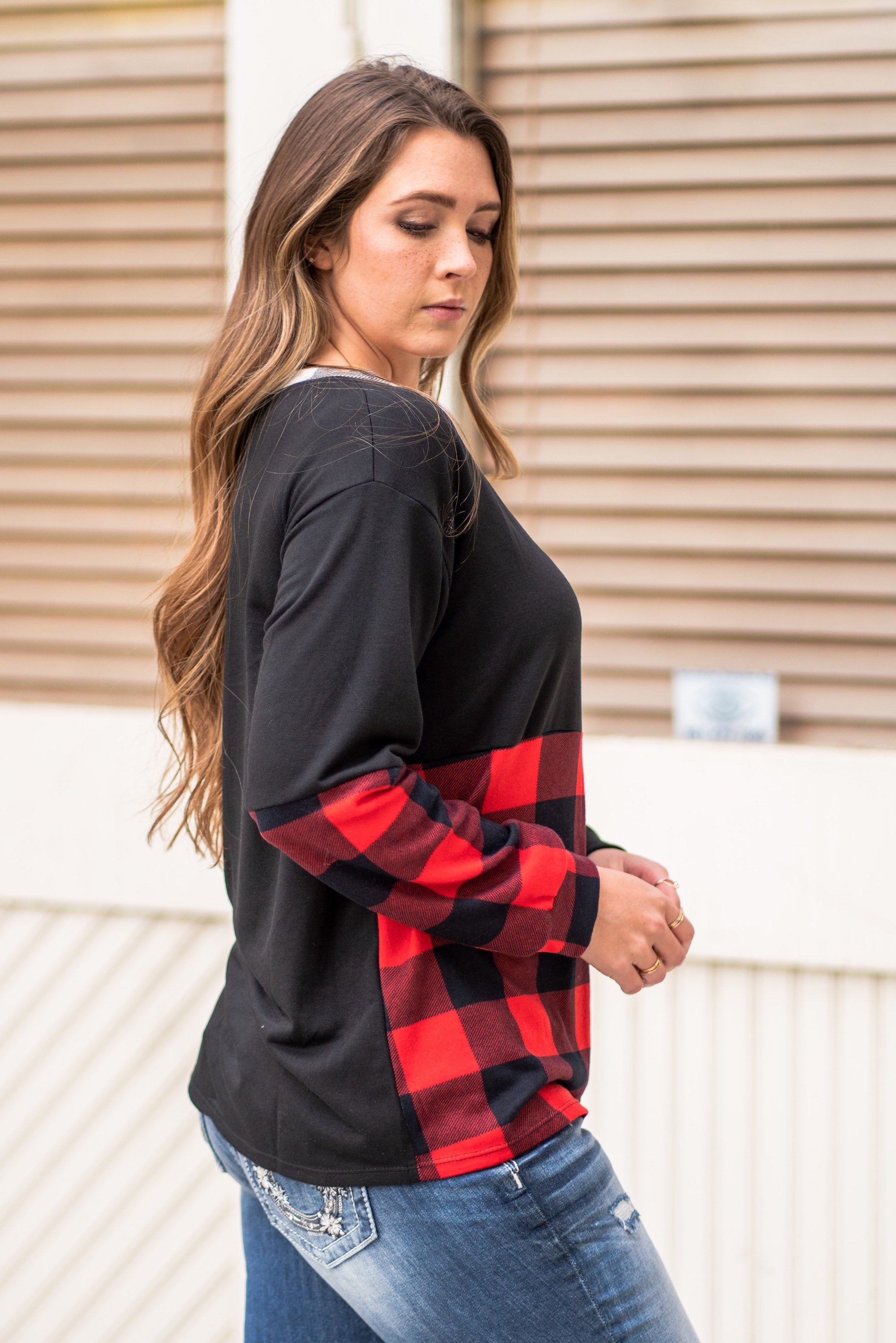 BiBi Throw on for an easy casual look with your favorite jeans this fall. Color: Black Neckline: V Neck Sleeve: Long Style #: BT2116 Contact us for any additional measurements or sizing.