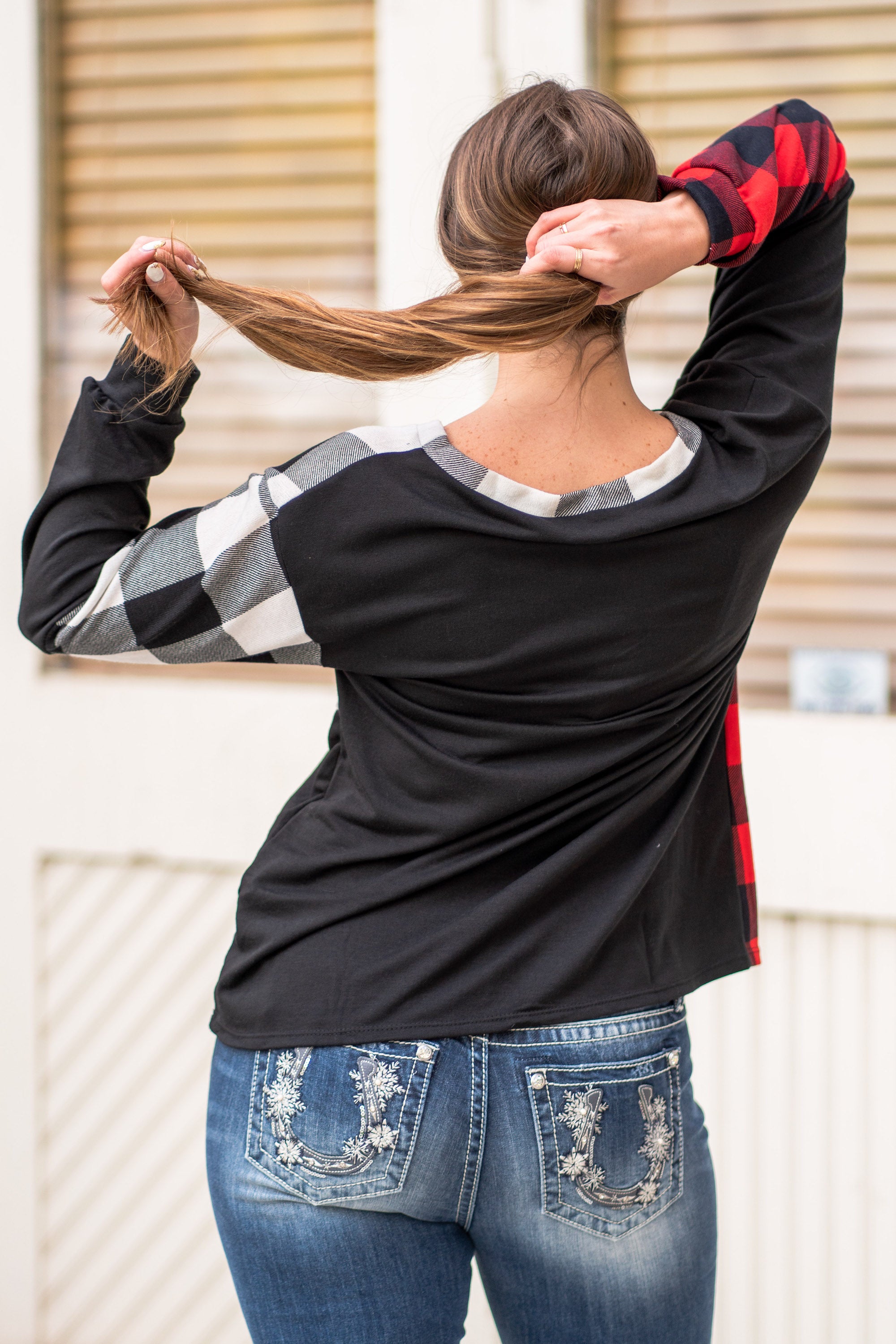 BiBi Throw on for an easy casual look with your favorite jeans this fall. Color: Black Neckline: V Neck Sleeve: Long Style #: BT2116 Contact us for any additional measurements or sizing.