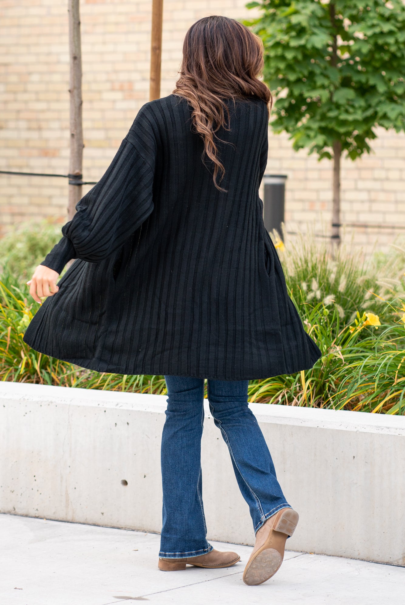 Blue Buttercup  Pair your favorite cami and jeans with this cute open front cardigan.    Color: Black  Neckline: Open  Sleeve: Long  Style #: SW60013 Contact us for any additional measurements or sizing.     