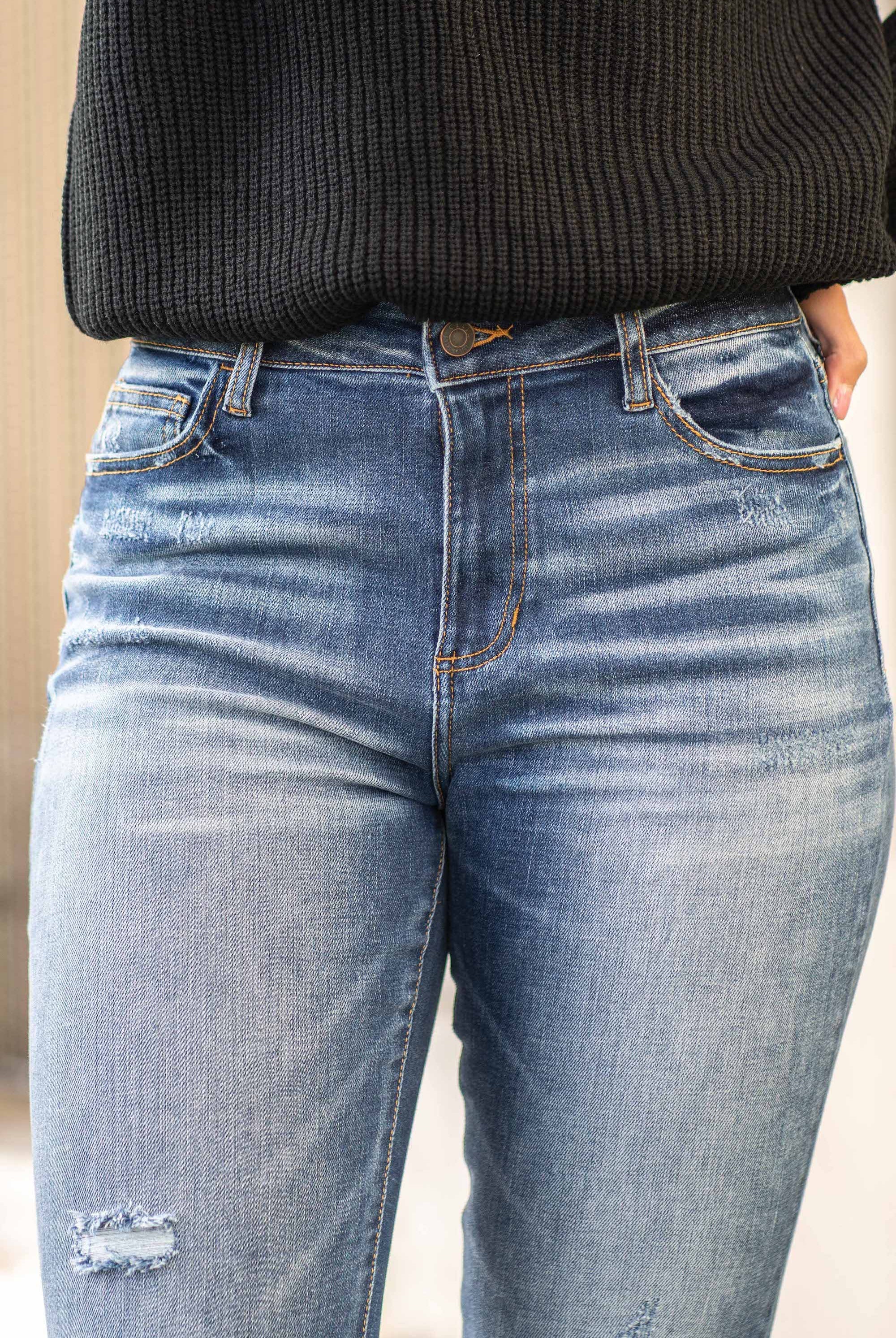 Cello Jeans Cellos signature sexy fit made from some of the best denim in the world. The ripped knees and frayed hem give that cool lived-in look. Additionally equipped with five pockets, belt loops and a zip fly closure. Color: Dark Blue Wash Cut: Skinny, 26" Inseam* Rise: High-Rise, 10" Front Rise* 94% Cotton 4% Polyester 2% Spandex Fly: Zipper Style #: WV77481DK Contact us for any additional measurements or sizing. *Measured on the smallest size, measurements may vary by size.