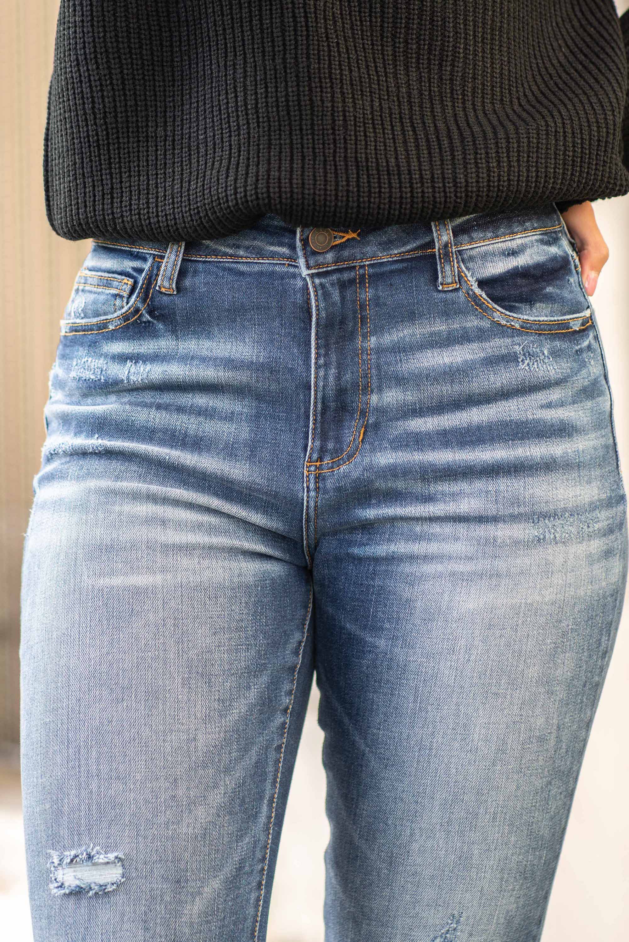 Cello Jeans Cellos signature sexy fit made from some of the best denim in the world. The ripped knees and frayed hem give that cool lived-in look. Additionally equipped with five pockets, belt loops and a zip fly closure. Color: Dark Blue Wash Cut: Skinny, 26" Inseam* Rise: High-Rise, 10" Front Rise* 94% Cotton 4% Polyester 2% Spandex Fly: Zipper Style #: WV77481DK Contact us for any additional measurements or sizing. *Measured on the smallest size, measurements may vary by size.