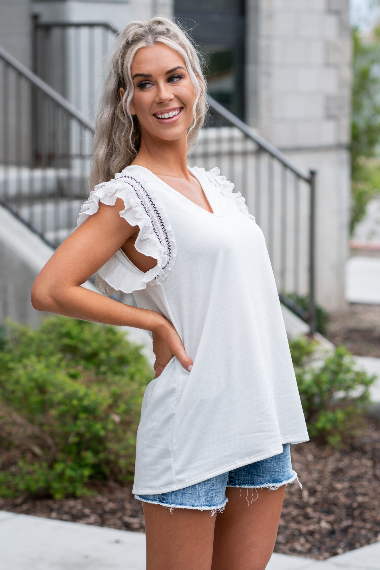 BiBi Throw on for an easy casual look with your favorite jeans. Color: Ivory Neckline: V Neck Sleeve: Sleeveless, Lace & Ruffle Lined 80% POLY 16% RAYON 4% SPAN Style #: BT1494A-01 Contact us for any additional measurements or sizing.