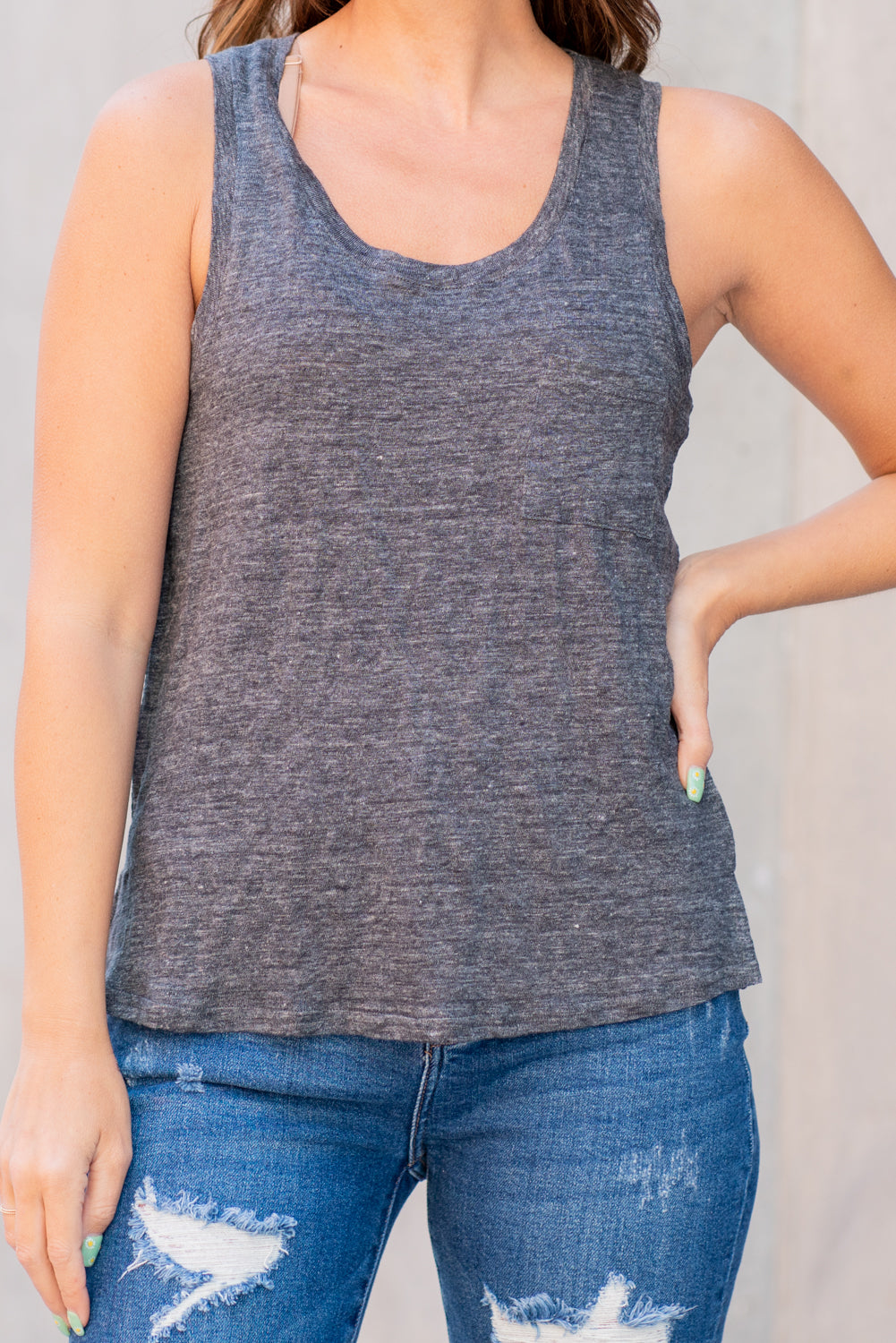 Thread & Supply This classic burnout tank is perfect to throw on with any of your favorite bottoms! Super comfy and relaxed fit, featuring a scoop neck and small front pocket detail. Color: Graphite Black Neckline: Wide Sleeve: Sleeveless Pocket Tee 100% Linen Style #: T1298LKTS-BK072 Contact us for any additional measurements or sizing.