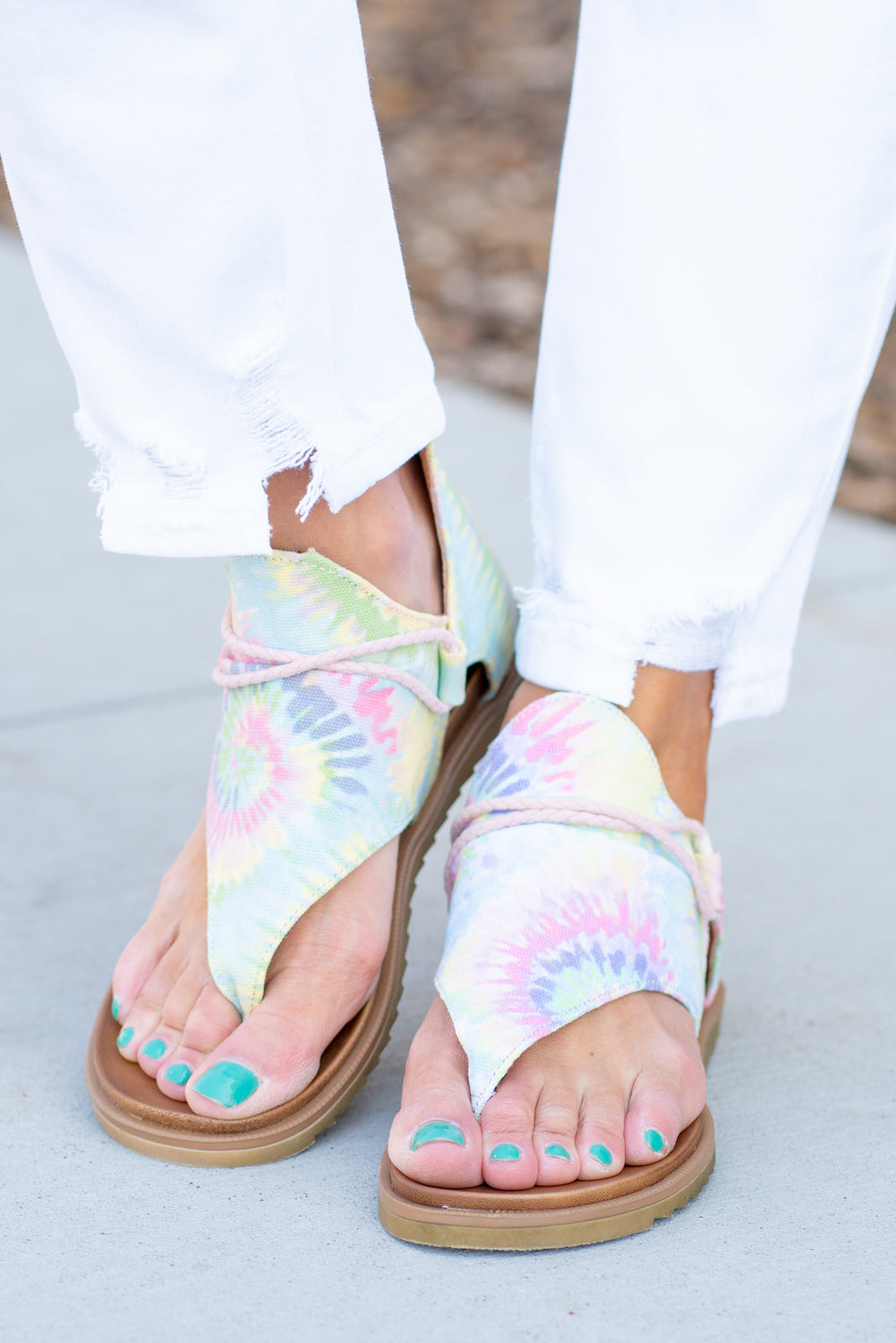 Zipper Sandal by Very G These iconic boutique sandals from Very G are must have! Wear all spring/summer to add a little sass to your wardrobe. Style Name: Dusk Color: Pastel Tie Dye Hooded synthetic upper with braided criss cross cord detailing Back zip closure for easy on/off Cushioned foot bed Durable textured outsole Style #: VGSA0121-Pastel Contact us for any additional measurements or sizing.