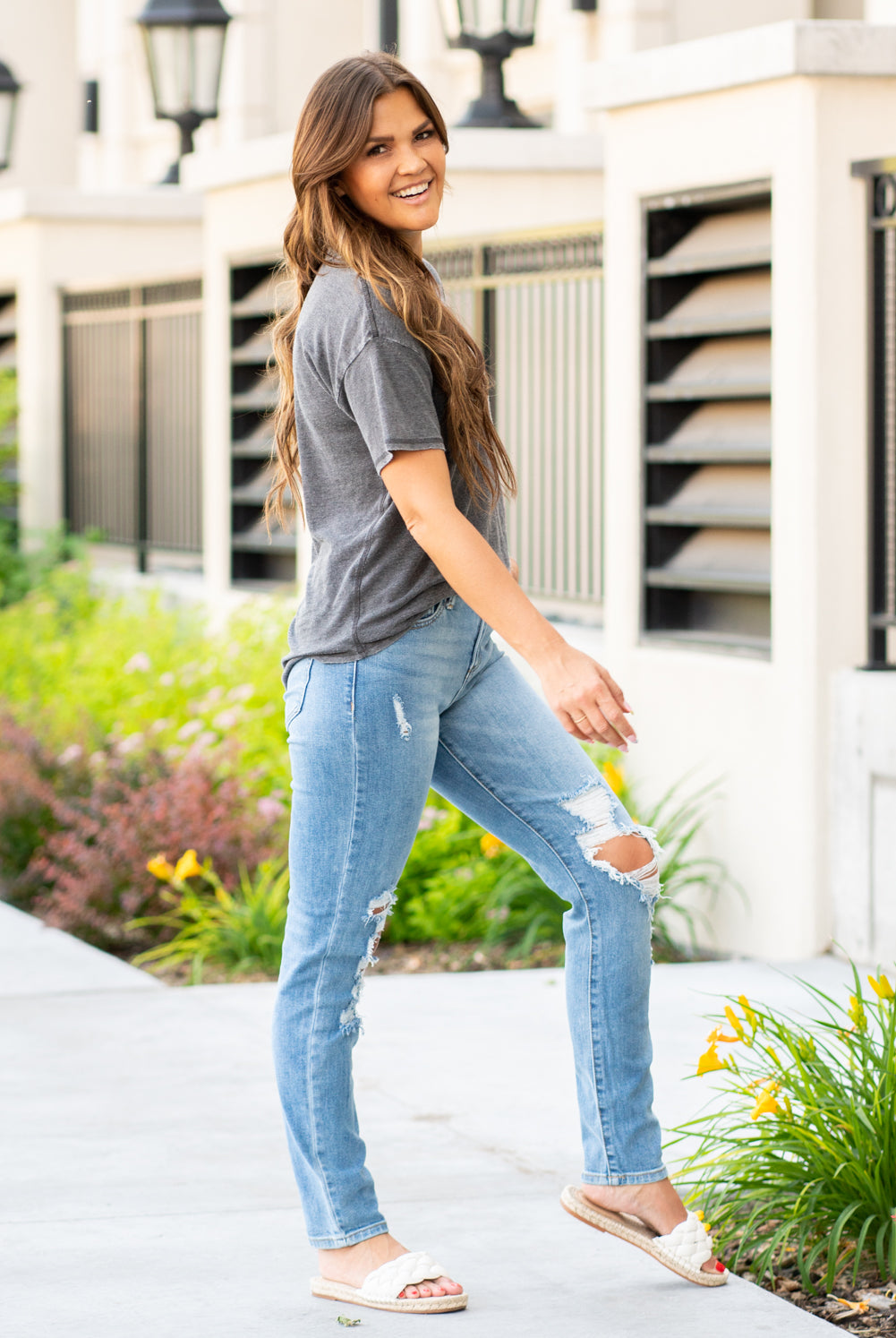 Sneak Peak Denim  These sneak peak jeans have all the right holes and a super cute relaxed leg fit.  Collection: Spring 2021 Tomboy Skinny Color: Medium Blue Cut: Flares, 29" Inseam Rise: High-Rise, 10.5" Front Rise 99% Cotton 1% Spandex Fly: Zipper  Style #: SP-P11601 Contact us for any additional measurements or sizing.