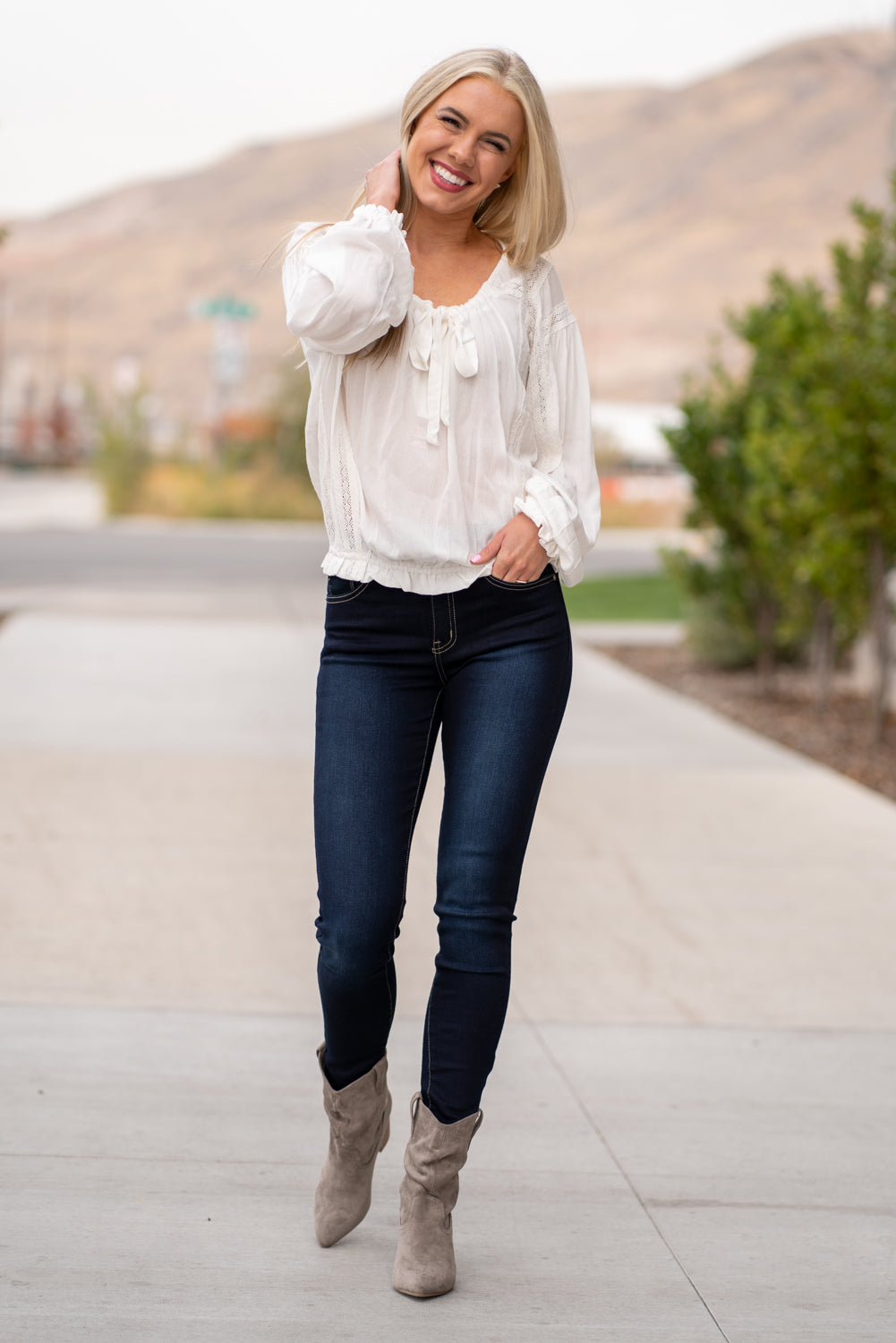 Boots by Mi.iM This city-slick cowboy style bootie kicks it up a notch with a bold stacked heel. Crafted from manmade suede, this upper is completed with a slight slouch in the ankle. Finished on our signature padded foot bed, they're a must for all day comfort. Man-made Upper Color: Grey Padded footbed Shaft Height: 5.75" Heel Height: 3.25" Opening: 12" Contact us for any additional measurements or sizing.