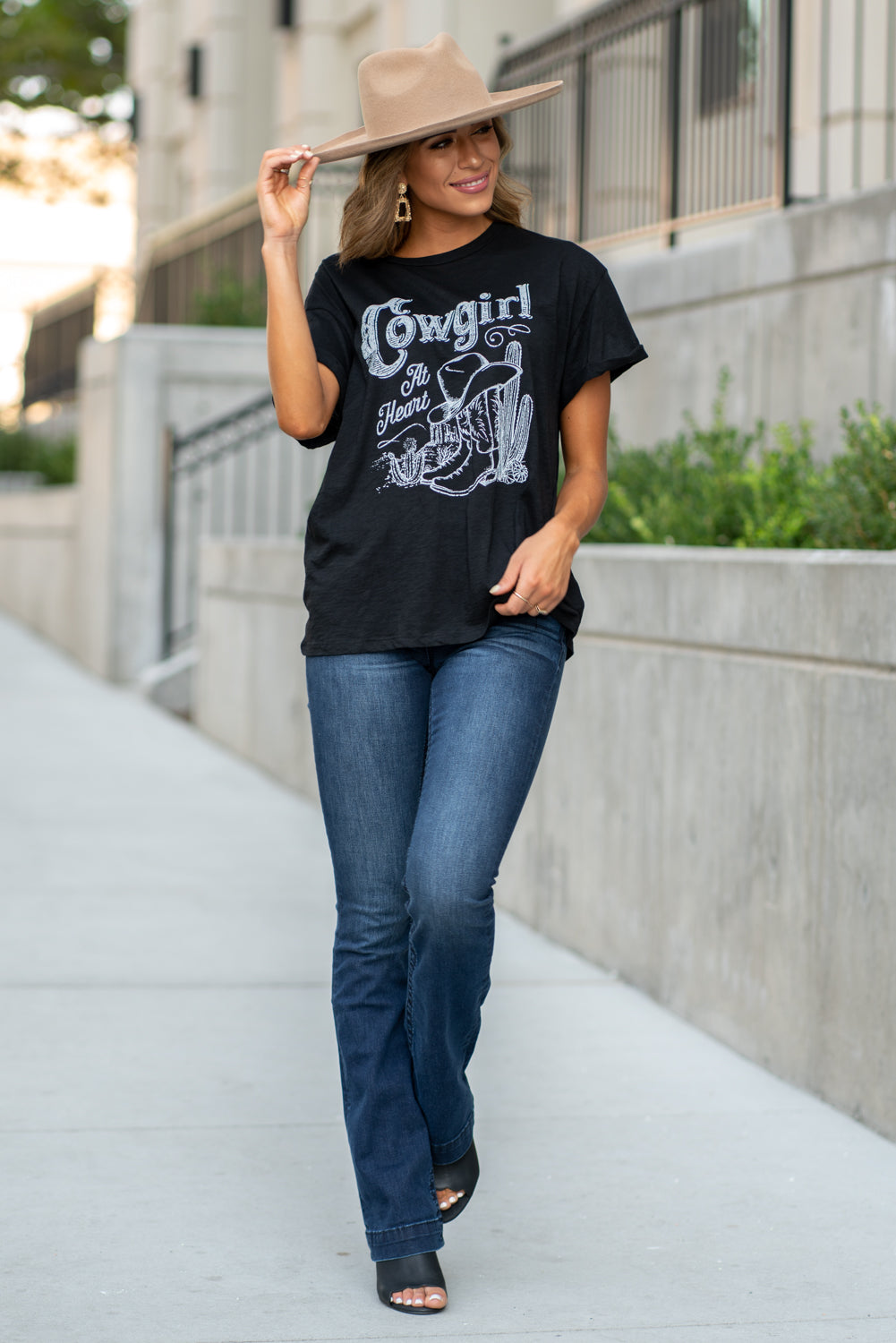 Zutter This top spoke to you, now tell everyone else. You are a cowgirl at heart. Collection: Fall 2020 Color: Black Neckline: Round Sleeve: Short Material: 50% Modal 50% Cotton Style #: F425-0139 Contact us for any additional measurements or sizing. Taylor is 5'7" and wears a size 3 in jeans, small top and an 8.5 in shoes. She is wearing a size small in this tee.