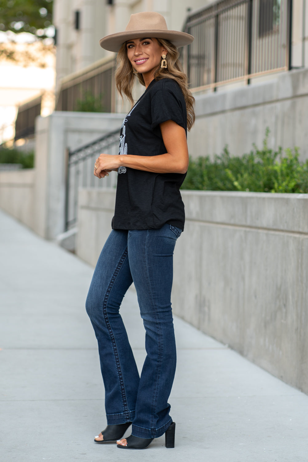 Zutter This top spoke to you, now tell everyone else. You are a cowgirl at heart. Collection: Fall 2020 Color: Black Neckline: Round Sleeve: Short Material: 50% Modal 50% Cotton Style #: F425-0139 Contact us for any additional measurements or sizing. Taylor is 5'7" and wears a size 3 in jeans, small top and an 8.5 in shoes. She is wearing a size small in this tee.