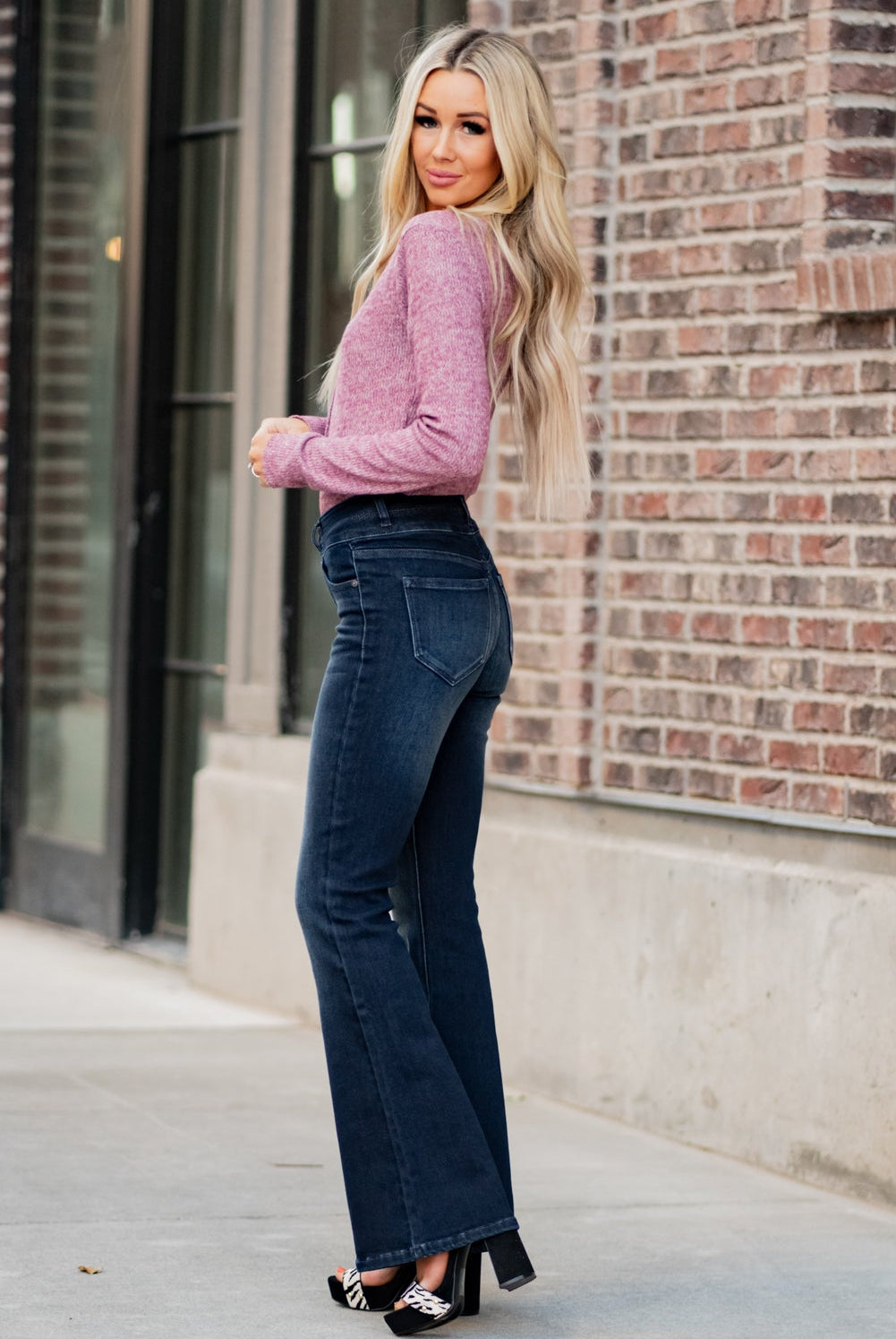 KanCan Jeans Collection: Fall 2020 Color: Dark Wash Cut: Flare Cut, 34" Inseam Rise: High-Rise, 10.5" Front Rise Material: 94% Cotton 4% Polyester2% Spandex Detail: Whisker Wash Fly: Zipper Fly with Double Button Closure Style #: KC7123D Contact us for any additional measurements or sizing. Haley is 5’6" and wears size 3 in jeans, a small top and 7.5 in shoes. She is wearing a 25 in these jeans.