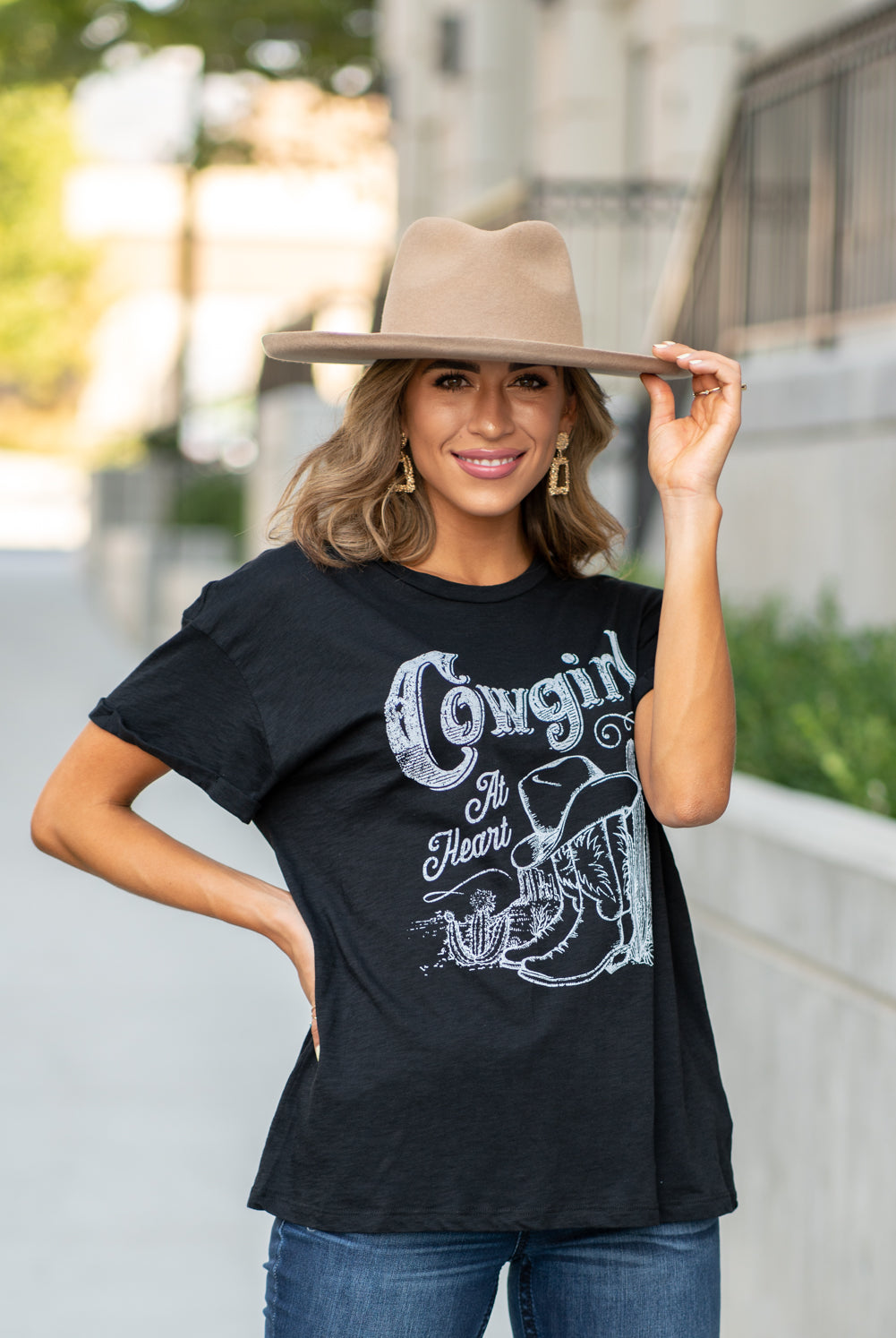 Zutter This top spoke to you, now tell everyone else. You are a cowgirl at heart. Collection: Fall 2020 Color: Black Neckline: Round Sleeve: Short Material: 50% Modal 50% Cotton Style #: F425-0139 Contact us for any additional measurements or sizing. Taylor is 5'7" and wears a size 3 in jeans, small top and an 8.5 in shoes. She is wearing a size small in this tee.