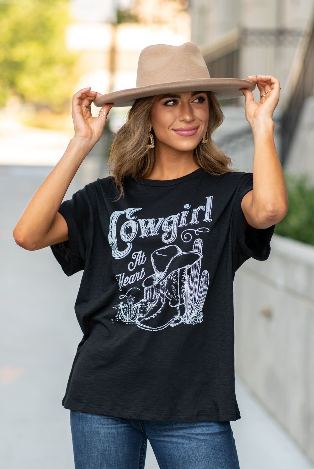 Zutter This top spoke to you, now tell everyone else. You are a cowgirl at heart. Collection: Fall 2020 Color: Black Neckline: Round Sleeve: Short Material: 50% Modal 50% Cotton Style #: F425-0139 Contact us for any additional measurements or sizing. Taylor is 5'7" and wears a size 3 in jeans, small top and an 8.5 in shoes. She is wearing a size small in this tee.