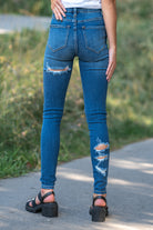Nature Denim  Collection: Fall 2020 Color: Dark Washed Cut: Skinny, 27" Inseam Rise: High Rise, 10" Front Rise  Ripped & Distressed on Front & Back Fly: Zipper Style #: NT1233M Contact us for any additional measurements or sizing.