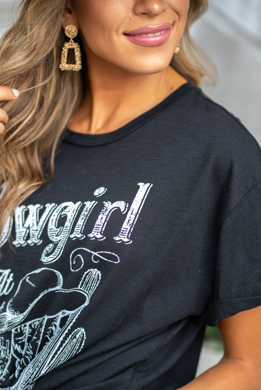 Zutter This top spoke to you, now tell everyone else. You are a cowgirl at heart. Collection: Fall 2020 Color: Black Neckline: Round Sleeve: Short Material: 50% Modal 50% Cotton Style #: F425-0139 Contact us for any additional measurements or sizing. Taylor is 5'7" and wears a size 3 in jeans, small top and an 8.5 in shoes. She is wearing a size small in this tee.