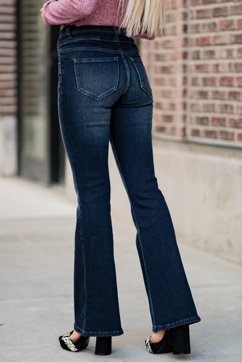 KanCan Jeans Collection: Fall 2020 Color: Dark Wash Cut: Flare Cut, 34" Inseam Rise: High-Rise, 10.5" Front Rise Material: 94% Cotton 4% Polyester2% Spandex Detail: Whisker Wash Fly: Zipper Fly with Double Button Closure Style #: KC7123D Contact us for any additional measurements or sizing. Haley is 5’6" and wears size 3 in jeans, a small top and 7.5 in shoes. She is wearing a 25 in these jeans.