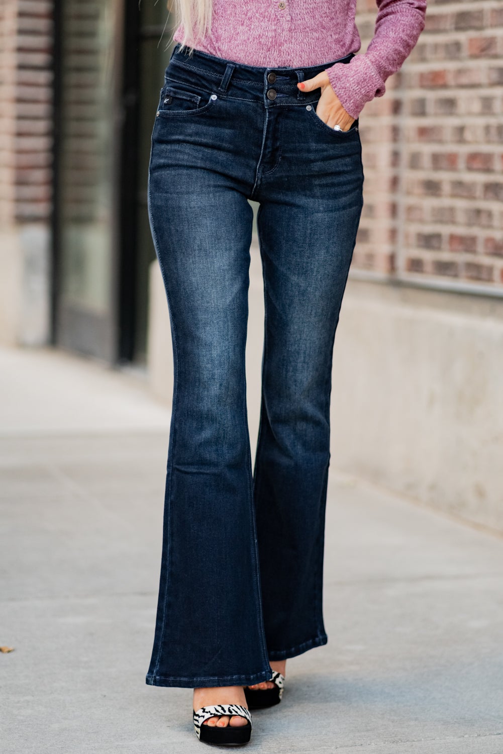 KanCan Jeans Collection: Fall 2020 Color: Dark Wash Cut: Flare Cut, 34" Inseam Rise: High-Rise, 10.5" Front Rise Material: 94% Cotton 4% Polyester2% Spandex Detail: Whisker Wash Fly: Zipper Fly with Double Button Closure Style #: KC7123D Contact us for any additional measurements or sizing. Haley is 5’6" and wears size 3 in jeans, a small top and 7.5 in shoes. She is wearing a 25 in these jeans.