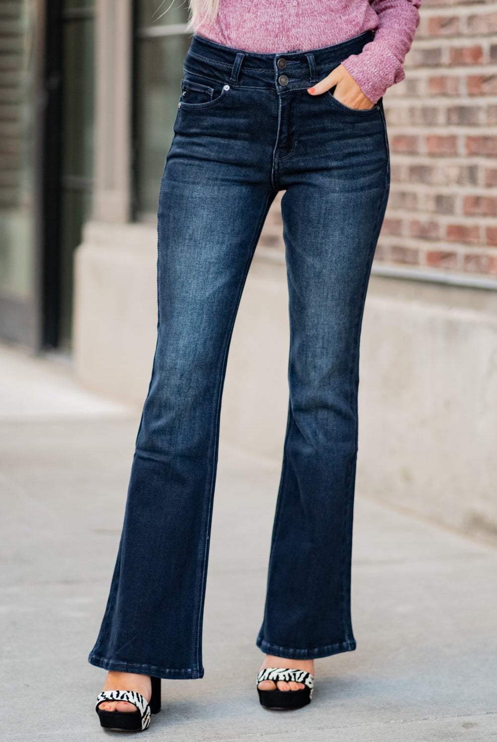 KanCan Jeans Collection: Fall 2020 Color: Dark Wash Cut: Flare Cut, 34" Inseam Rise: High-Rise, 10.5" Front Rise Material: 94% Cotton 4% Polyester2% Spandex Detail: Whisker Wash Fly: Zipper Fly with Double Button Closure Style #: KC7123D Contact us for any additional measurements or sizing. Haley is 5’6" and wears size 3 in jeans, a small top and 7.5 in shoes. She is wearing a 25 in these jeans.