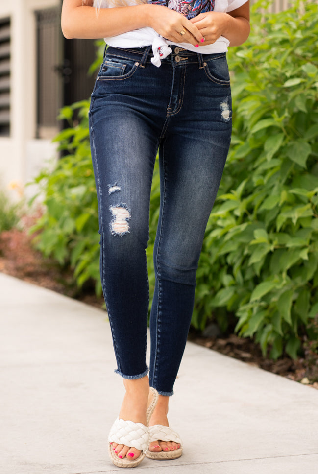 KanCan Jeans Color: Dark Wash Fray Hem Cut: Skinny, 27" Inseam Rise: High-Rise, 10" Front Rise COTTON 94.9% POLYESTER 3.8% SPANDEX 1.3% Stitching: Classic Fly: Exposed Button Fly Style #: KC7317D Contact us for any additional measurements or sizing. Haley wears a size small top, a 1 in jeans and a small in tops. She is wearing a size 24/1 in these jeans.