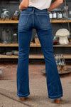 KanCan Jeans  These stretchy mid-rise flares with button-up fly will be your new favorite jeans. With a 32" inseam, you can wear them with flats all summer long.  Collection: Core Style  Flare, 32" Inseam* Mid Rise, 9.75" Front Rise* Dark Blue Wash  78% COTTON, 16% POLYESTER, 4% RAYON, 2% SPANDEX Fly: Exposed Button Fly Style #: KC6327FD-PT Contact us for any additional measurements or sizing. 