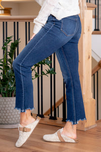 Flying Monkey  Indulge in style and comfort with our Comfort Stretch Denim, High Rise Slim Straight Jeans. The high-rise waist provides a flattering fit, while the seamless waistband ensures comfort throughout the day. The irregular raw step hem adds a touch of edge, and the cropped length keeps it trendy. Embrace the sleek and slim look with these versatile jeans, perfect for various occasions.