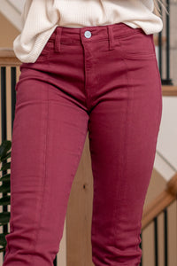 Belinda Mid Rise Skinny Straight Leg Jeans comes in three beautiful color tones. Made with stretchy denim fabric that hugs your body in the right places. This jean sits right at the waist for an easy fit that's both comfortable and chic. Features a front center slit, for an edgier look and feel.  Color: Burgundy Cut: Skinny Straight, 27" Inseam* Rise: Mid-Rise, 9.5" Front Rise* Material: 94.8% Cotton, 4% t-400, 1.2% Spandex Stitching: Classic Fly: Zipper  Style #: KC7453BU