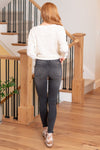 KanCan Jeans   Introducing the Hermione High Rise Jeans, a perfect blend of comfort and style. These ankle skinny jeans feature a faded black wash, frayed hem, and subtle whiskering for a trendy look. Designed to sit above the natural waistline, they taper down to hit right at the ankle, offering versatility and chic style.