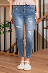 KanCan Jeans  Introducing the Ellington High-Rise Ankle Skinny Jeans, your go-to classic skinnies for any occasion. These jeans strike the perfect balance with just the right amount of distress, slit hems, and fading and whiskering details for that lived-in appeal. The classic five-pocket design ensures practicality, and the button fly closure adds a timeless touch. Complete with silver-colored hardware, these jeans are ready to be dressed up or down, making them a versatile addition to your wardrobe.