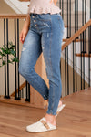 KanCan Jeans  Introducing the Ellington High-Rise Ankle Skinny Jeans, your go-to classic skinnies for any occasion. These jeans strike the perfect balance with just the right amount of distress, slit hems, and fading and whiskering details for that lived-in appeal. The classic five-pocket design ensures practicality, and the button fly closure adds a timeless touch. Complete with silver-colored hardware, these jeans are ready to be dressed up or down, making them a versatile addition to your wardrobe.