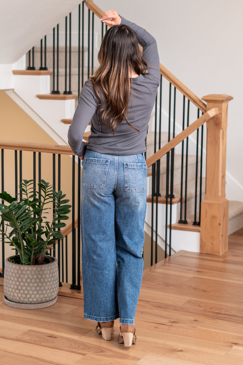 KanCan Jeans   Ultra High Rise 90s Wide Leg Jeans, a nod to the iconic '90s style. While they feature a rigid stretchiness level, these jeans offer a unique design with a hidden button fly, a dart on the back waist, and front slant pockets. The one-inch wide hem adds a trendy twist to complete the look. Color: Dark Wash Cut: FIT, 30" Inseam* Rise:-Rise, 11 1/2" Front Rise* Material: 100% Cotton, Rigid Stitching: Classic Fly: Button Fly Style #: KC7948D