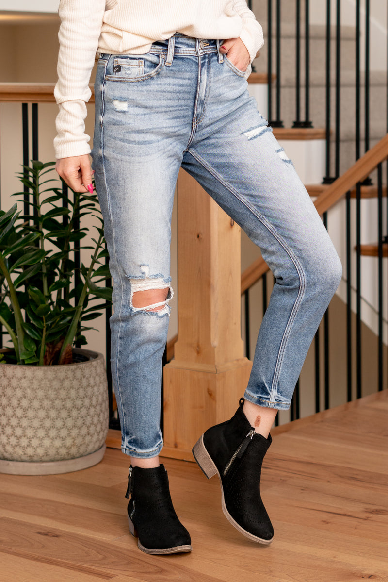 KanCan Jeans   Say hello to the Kelly High Rise Distressed Mom Jeans, a perfect blend of vintage charm and contemporary edge. These jeans feature a flattering high rise and a classic mom fit, providing a comfortable yet on-trend silhouette.