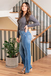 KanCan Jeans   Embrace the 90's style with these Straight Leg Jeans. With styling & feel reminiscent of the era, they come with a modern twist featuring a waist seam, cut seam, slit, and a trendy release hem. These jeans are perfect for a stylish and nostalgic look. Color: Medium Blue  Cut: Straight, 31" Inseam* Rise:-Rise, 11 3/4" Front Rise* Material: 100% Cotton, Rigid Denim Stitching: Classic Fly: Zipper  Style #: KC8721M
