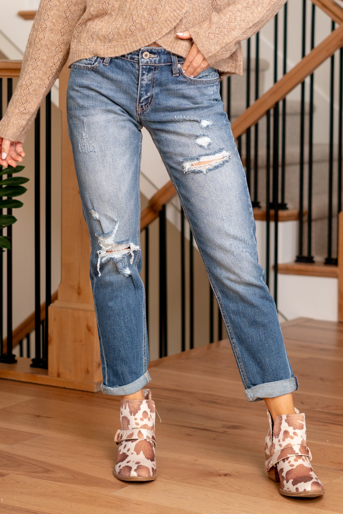 KanCan Jeans   Revamp your casual style with the Scottie Mid Rise Boyfriend Fit jeans, featuring distressed details for an effortlessly cool look. These jeans offer a comfortable mid-rise and a relaxed boyfriend fit, striking the perfect balance between laid-back and chic. The distressed details add a touch of edgy flair, making them a versatile choice for various occasions.