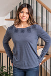 Hem & Thread   Introducing the Morgan Embroidered Tie Back Long Sleeve Tee – a blend of style and comfort with delicate embroidery and a flattering tie-back design, perfect for any occasion.  Color: Navy Neckline: Open  Material: 65% Cotton 35% Polyester Style #: 31576W-Navy Contact us for any additional measurements or sizing. 