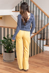KanCan Jeans   Ultra High Rise Wide Leg Jeans in a vibrant mustard color. Crafted from stretch fabric, these jeans offer both comfort and a trendy look. They feature a zipper fly, unique patched pocket details, and back darts for added style. Color: Mustard Yellow Cut: FIT, 32" Inseam* Rise:-Rise, 11" Front Rise* Material: 97% Cotton, 3% Spandex Stitching: Classic Fly: Zipper  Style #: KC2086MT