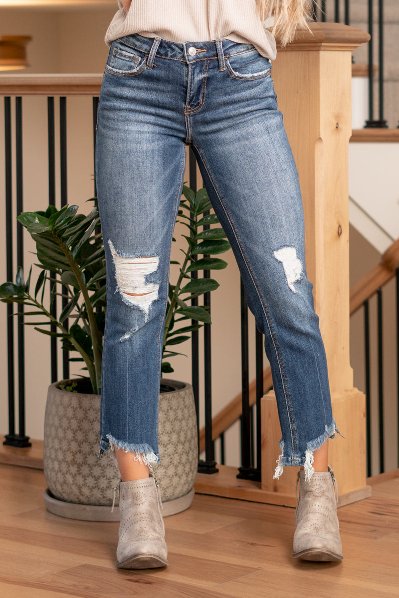Lovervet by VERVET   Embrace an edgy allure with the Spellbound Mid Rise Crop Kick Flare jeans, featuring distressed detailing. These jeans combine a flattering mid-rise silhouette with a trendy kick flare leg, creating a unique and contemporary look. The cropped length adds a touch of modernity, perfect for showcasing your favorite footwear.