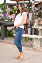 KanCan Jeans Color: Dark Wash Cut: Skinny, 27" Inseam* Rise: Mid-Rise, 9" Front Rise* 74% COTTON, 10% RAYON, 15% POLYESTER, 1% SPANDEX Stitching: Classic Fly: Zipper Style #: KC20009D Contact us for any additional measurements or sizing.  *Measured on the smallest size, measurements may vary by size.  Jacquelyn wears a size 25 in jeans, a small in tops, and 6.5 in shoes. She is wearing size 25 in these jeans.