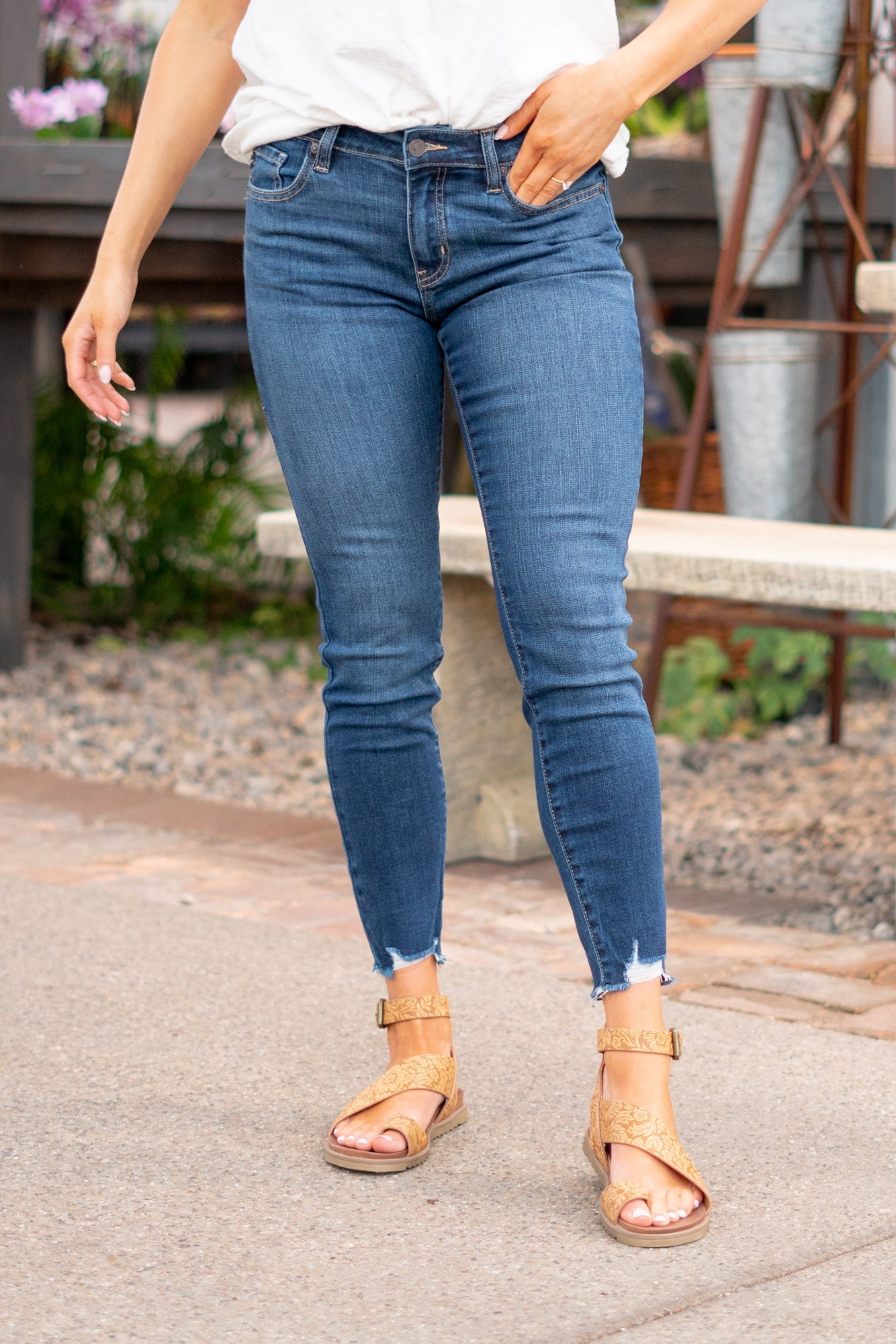 KanCan Jeans Color: Dark Wash Cut: Skinny, 27" Inseam* Rise: Mid-Rise, 9" Front Rise* 74% COTTON, 10% RAYON, 15% POLYESTER, 1% SPANDEX Stitching: Classic Fly: Zipper Style #: KC20009D Contact us for any additional measurements or sizing.  *Measured on the smallest size, measurements may vary by size.  Jacquelyn wears a size 25 in jeans, a small in tops, and 6.5 in shoes. She is wearing size 25 in these jeans.