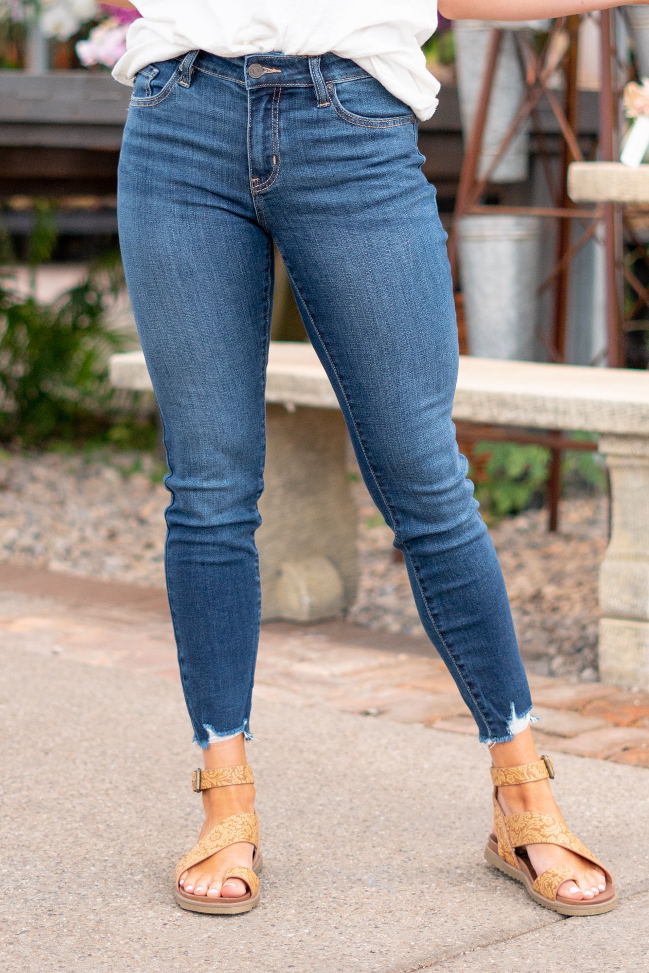 KanCan Jeans Color: Dark Wash Cut: Skinny, 27" Inseam* Rise: Mid-Rise, 9" Front Rise* 74% COTTON, 10% RAYON, 15% POLYESTER, 1% SPANDEX Stitching: Classic Fly: Zipper Style #: KC20009D Contact us for any additional measurements or sizing.  *Measured on the smallest size, measurements may vary by size.  Jacquelyn wears a size 25 in jeans, a small in tops, and 6.5 in shoes. She is wearing size 25 in these jeans.