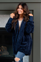 Hem & Thread   This is that cozy jacket you will throw on every day and go! One size fits most with an open neckline and long sleeve and side pockets.   Color: Navy Neckline: Open  Sleeve: Long 100% POLYESTER Style #: L2394-Navy Contact us for any additional measurements or sizing. 