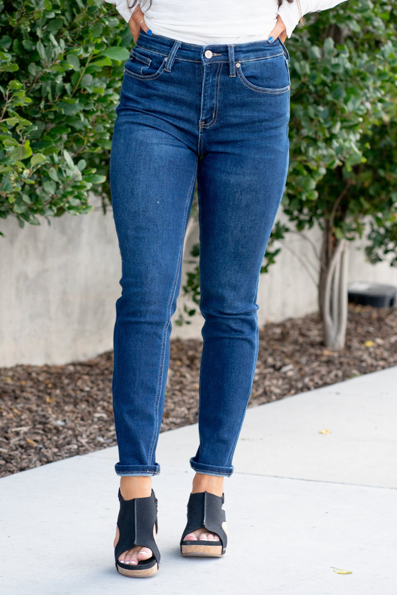 KanCan Jeans  With a high waist and cigarette straight fit, these will be your go-to jeans that will never go out of style. Color: Dark Blue  Cut: Straight Fit, 29" Inseam* Rise: High-Rise, 10.5" Front Rise* 75%COTTON, 23%TENCEL 2%SPANDEX Fly: Zipper Style #: KC4009D Contact us for any additional measurements or sizing.  *Measured on the smallest size, measurements may vary by size.