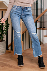 VERVET by Flying Monkey Jeans  Introducing the Straightforward Alison Mid Rise Uneven Hem Ankle Flare jeans – where simplicity meets modernity. These jeans boast a flattering mid-rise fit and an on-trend ankle flare with an uneven hem, providing a perfect blend of classic style and contemporary design.