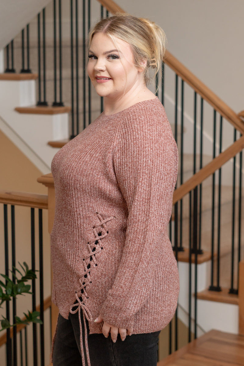 Step into comfort and style with our Soft Knit Crisscross Sweater. This cozy sweater is crafted from a soft knit fabric, ensuring a comfortable and relaxed fit. The crisscross detailing adds a trendy and playful element, creating a unique look that stands out. Embrace the warmth and style of this crisscross sweater for a fashion-forward and comfortable ensemble.  Color: Brick Sleeves: Long Neckline: Round Material: 100% Polyester Style #: LV12010 Contact us for any additional measurements or sizing. 