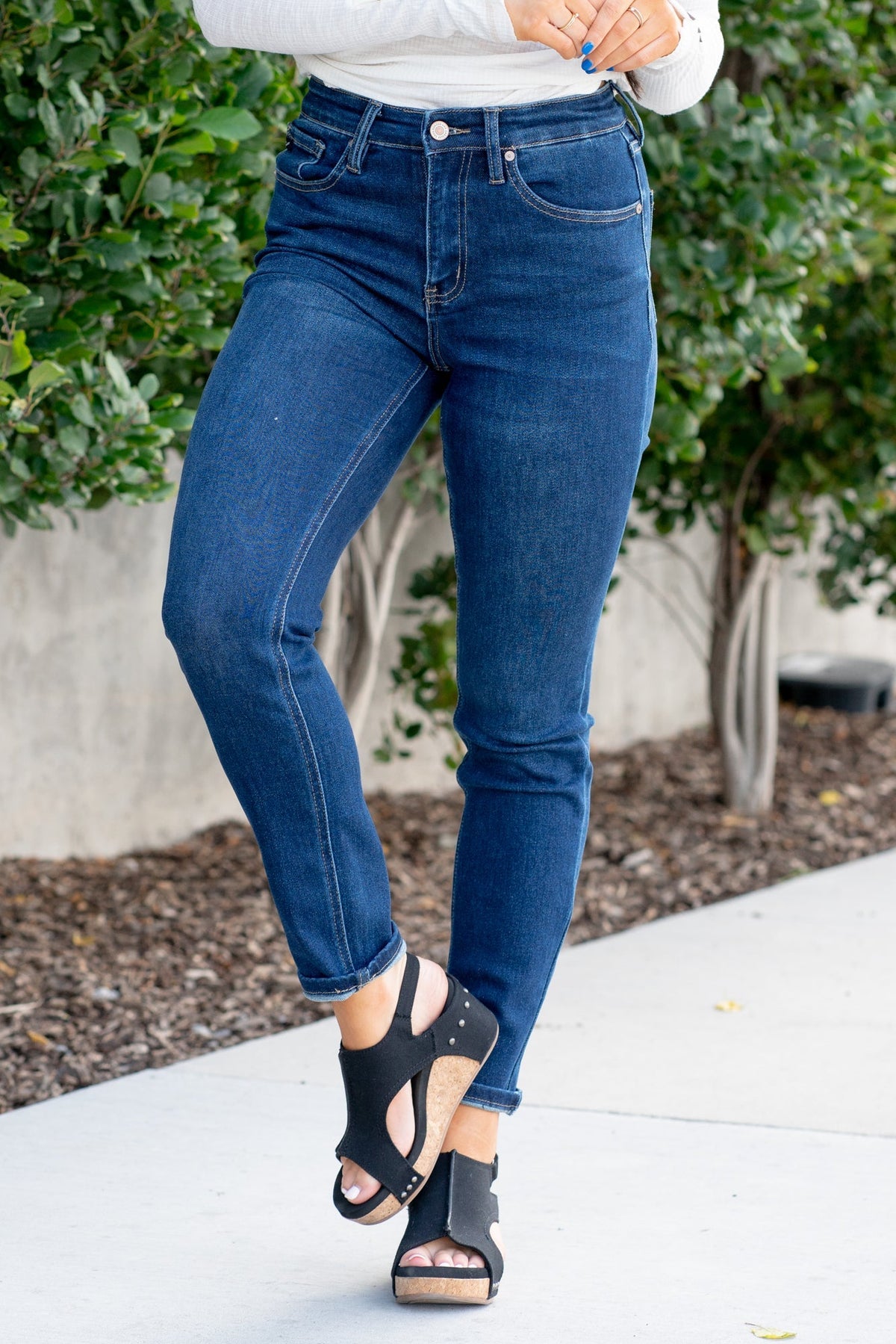 KanCan Jeans  With a high waist and cigarette straight fit, these will be your go-to jeans that will never go out of style. Color: Dark Blue  Cut: Straight Fit, 29" Inseam* Rise: High-Rise, 10.5" Front Rise* 75%COTTON, 23%TENCEL 2%SPANDEX Fly: Zipper Style #: KC4009D Contact us for any additional measurements or sizing.  *Measured on the smallest size, measurements may vary by size.