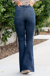 Judy Blue  Don't be afraid to wear high-waisted jeans, especially these flares. With a dark blue wash and a cut hem detail, these will be your favorite denim to dress up. Color: Dark Blue Wash Cut: Flare, 34" Inseam* Rise: High-Rise. 10.75" Front Rise* Material: 52% Cotton / 23% Polyester / 22% Rayon / 3% Spandex Stitching: Classic  Fly: Zipper Style #: JB82343-PL | 82343-PL *Measured on the smallest size, measurements may vary by size.  Contact us for any additional measurements or sizing.