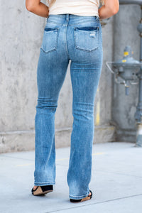 Judy Blue  Boot cuts are back in style and this cute high-rise is a perfect fit! With a medium blue whiskered wash, these are versatile and stretchy denim you will love. Color: Medium Blue Wash Cut: Boot Cut, 32.5" Inseam* Rise: High-Rise, 10.5" Front Rise* Material: 93% Cotton / 6% Polyester / 1% Spandex Machine Wash Separately In Cold Water Stitching: Classic Fly: Zipper Style #: JB82405 | 82405 Contact us for any additional measurements or sizing.