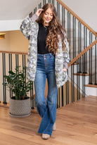 Hem & Thread   This is that cozy jacket you will throw on every day and go! One size fits most with an open neckline and long sleeves and side pockets.   Color: Gray Camo Neckline: Open  Sleeve: Long 100% POLYESTER Style #: 19919C-GrayCamo