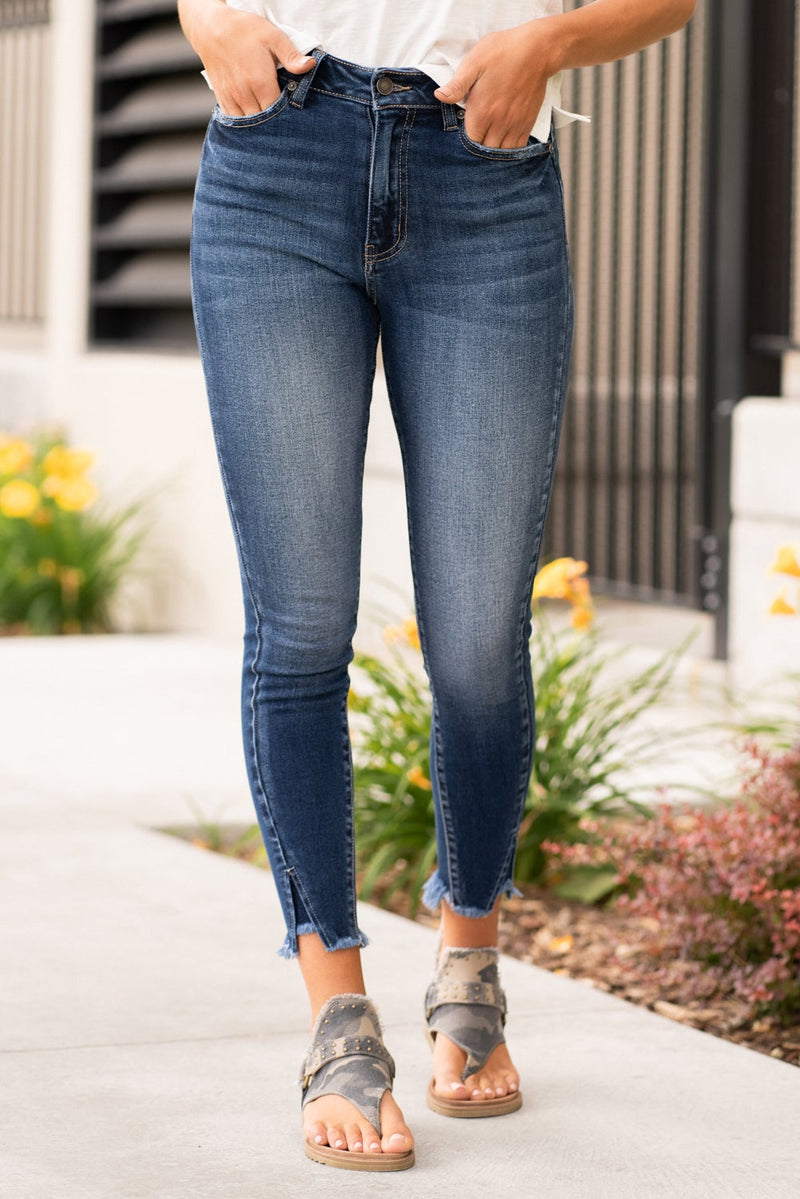 KanCan Jeans These high rise dark wash skinny jeans have a split fray hem, Pair with any tee and sneakers for a casual summer look.  KanCan Stretch Level: Comfort Stretch  Color: Dark Blue Cut: Skinny, 27.5" Inseam Rise: High-Rise, 10" Front Rise 82.5% COTTON, 11.5% GRACELL, 4.5% POLYESTER, 1.5% SPANDEX Stitching: Classic  Fly: Zipper Style #: KC7140D Contact us for any additional measurements or sizing.   