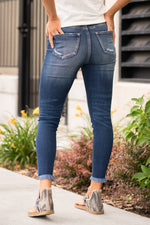 KanCan Jeans These high rise dark wash skinny jeans have a split fray hem, Pair with any tee and sneakers for a casual summer look.  KanCan Stretch Level: Comfort Stretch  Color: Dark Blue Cut: Skinny, 27.5" Inseam Rise: High-Rise, 10" Front Rise 82.5% COTTON, 11.5% GRACELL, 4.5% POLYESTER, 1.5% SPANDEX Stitching: Classic  Fly: Zipper Style #: KC7140D Contact us for any additional measurements or sizing.   