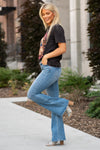 KanCan Jeans  Don't be afraid to wear flares again, not when they look this good! These mid-rise flare jeans hit at exactly the right spot on your waist and with some spandex, these will stretch as you wear and get super comfy!   KanCan Stretch Level: Comfort Stretch   Collection: Core Style  Color: Light Blue Wash Cut: Flare, 33.75" Inseam  Rise: Mid-Rise, 9" Front Rise 68% COTTON , 30% POLYESTER , 2% SPANDEX Fly: Zipper Style #: KC6102TL Contact us for any additional measurements or sizing. 